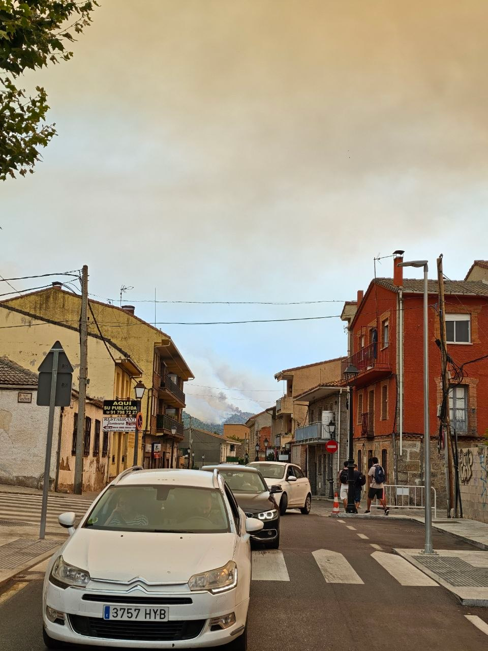 Traffic jam in town, fire behind us